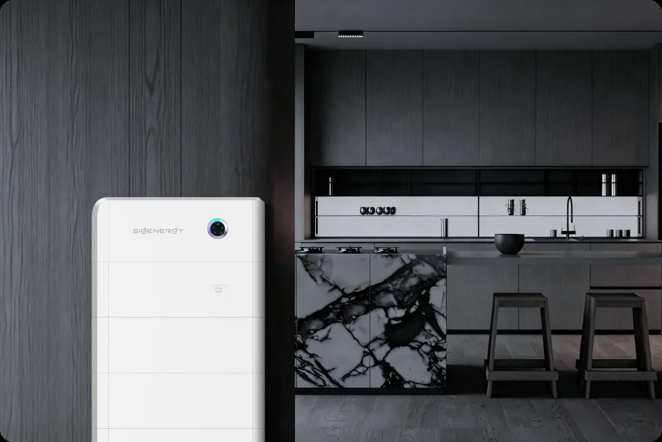 A Sigenergy SigenStor battery installed against the wall of a modern home interior beside the kitchen